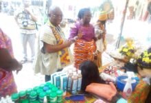 • Dr Letsa (in smock) admiring locally-made products at the Volta Region Arts and Culture Festival in Ho