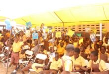 • Pupils of Kwashieman 1 Basic School showing some books presented to them during the international literacy day celebration Photo: Ebo Gorman