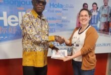 Mr Owusu - Koranteng presenting the books to Ms Viguier Christiana Anne Grace