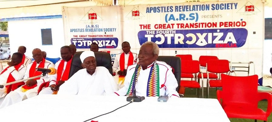 • Apostle Attipoe (right) addressing members of the church