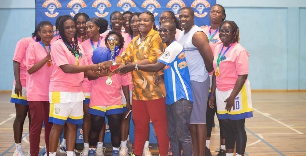 • Madam Toppar-Commodore (arrowed) presenting the female trophy to the skipper of Braves, Belinda Tawiah