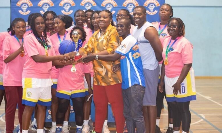 • Madam Toppar-Commodore (arrowed) presenting the female trophy to the skipper of Braves, Belinda Tawiah