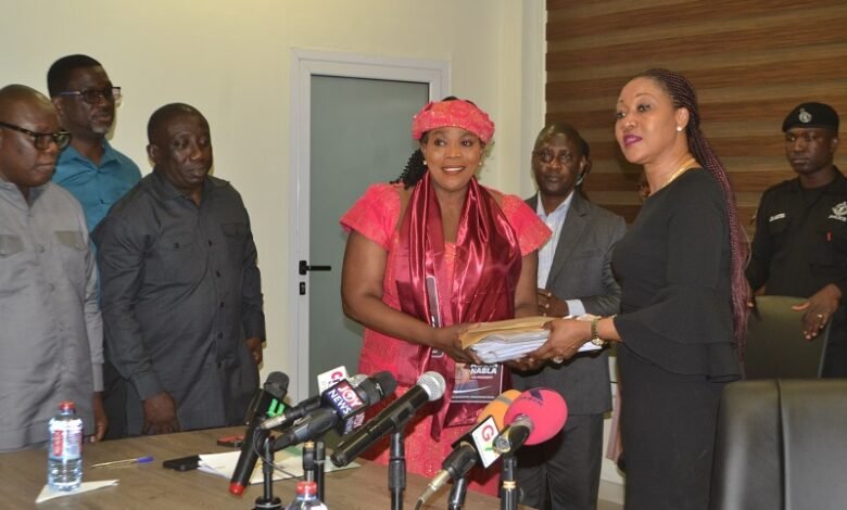 • Mrs Jean Mensa (right) receiving the documents from Ms Janet Asana Nabla of the PNP Photos: Victor A. Buxton