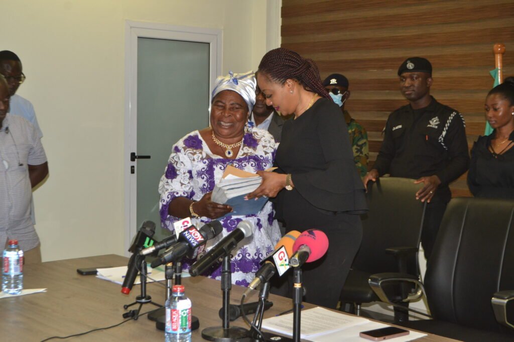 •
Ms Akua Donkor of GFP (left) presenting her documents to Mrs Jean Mensa