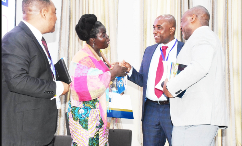 • Dr Efua Commeh (second from left) interacting with Prof. Kwaku Poku Asante (second from right).With them are Prof. Gordon Awandare (right) and Prof. Alfred Yawson,Provost ,CHS Photo: Seth Osabukle