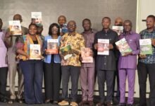 • Stakeholders displaying the WIP document at the event