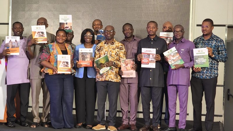 • Stakeholders displaying the WIP document at the event
