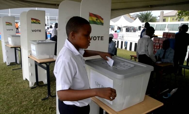 • A student casting his ballot