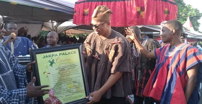 • Mr Adam Mutawakilu Garlus (second from right) receiving his award