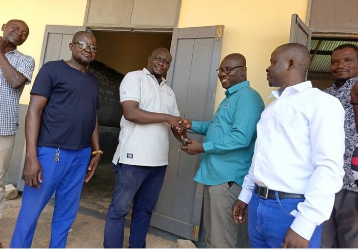 • Mr Kwame Agbodza (third from left) presenting the cement on behalf of Mr Mahama to the church officials