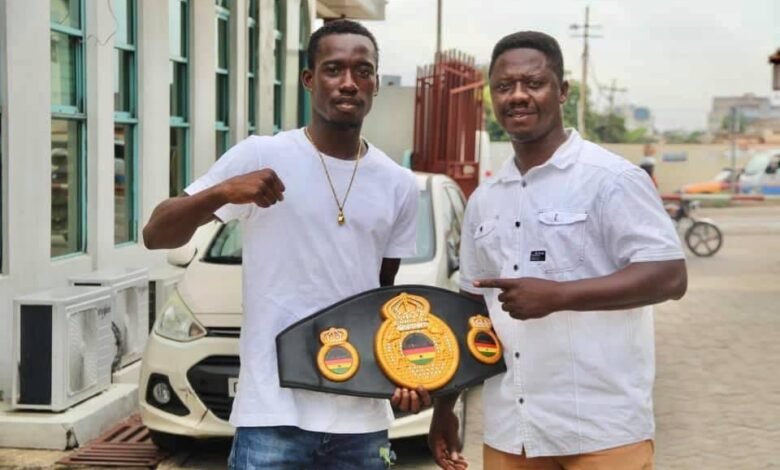 • Coach Carl Lokko (right) and John Laryea with his title