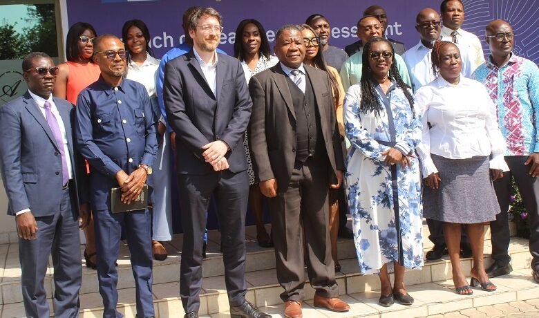 • Dr Mohammed Amin Adam (seventh from right), Emeritus Professor Aryeetey (sixth from right) with participants after the programme Photo: Ebo Gorman