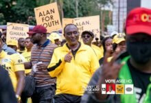 • Mr Kyerematen (inset) leading supporters in a walk in Kumasi