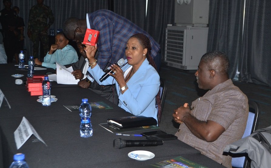 Mrs Jean Mensa (second from right) displaying the hard drive to be given to all political parties Photo Victor A. Buxton