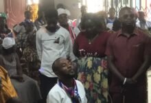 • Jerry Ahmed Shaib (kneeling down) surrounded by members of his campaign team receiving prayers at the service