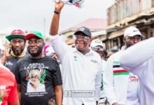 • Mr Abdul Latif Dan (middle) and some supporters in a walk