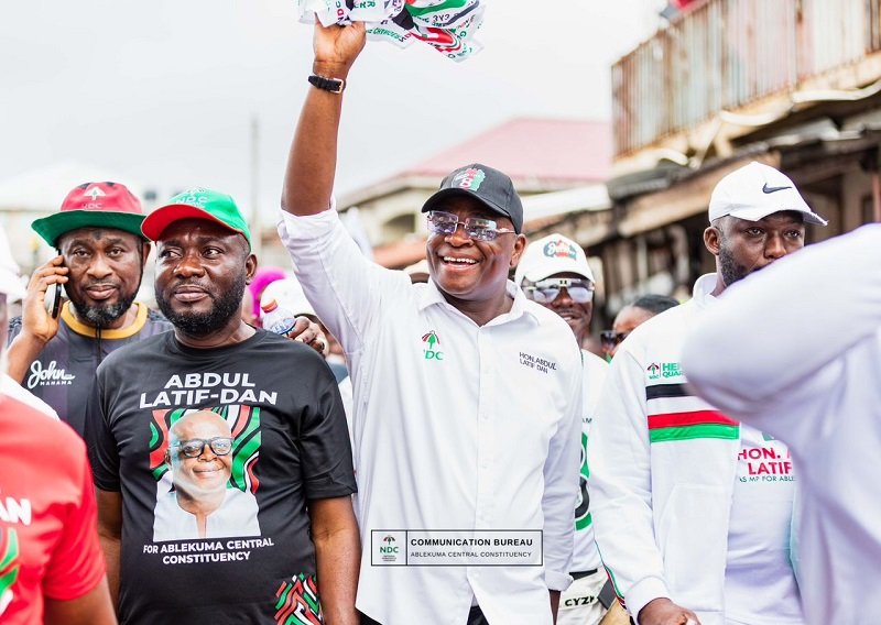 • Mr Abdul Latif Dan (middle) and some supporters in a walk