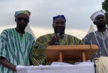 Mohammed Tahiru Nambe to Mrs Rejoice Acolor (middle) speaking at the programme