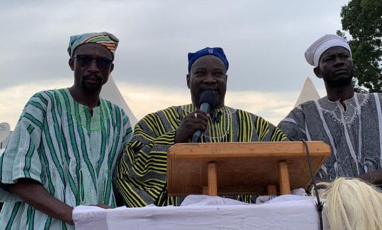 Mohammed Tahiru Nambe to Mrs Rejoice Acolor (middle) speaking at the programme