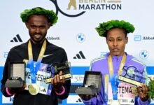 • Mengesha and Ketema with their trophies and medals