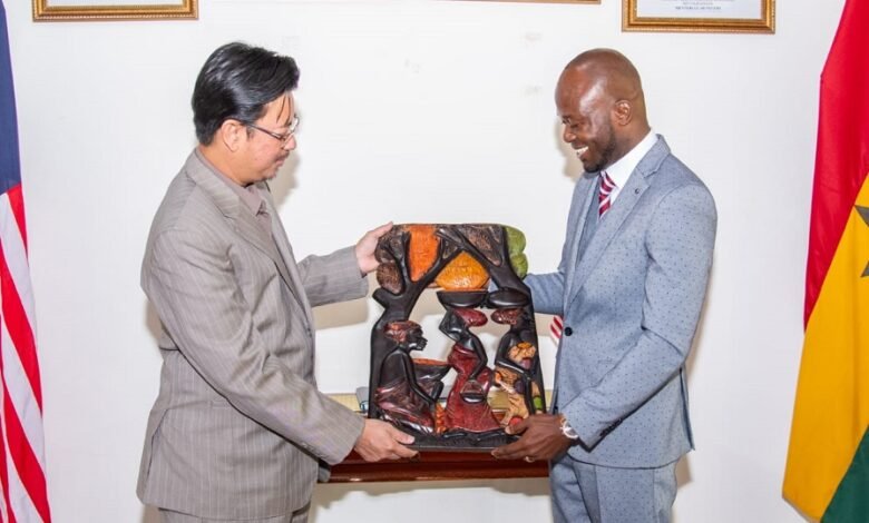 • Mr Annan (right) presenting an artifact to the Malaysian High Commissioner