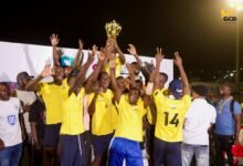 • Players of Team GCB Bank celebrate with the trophy