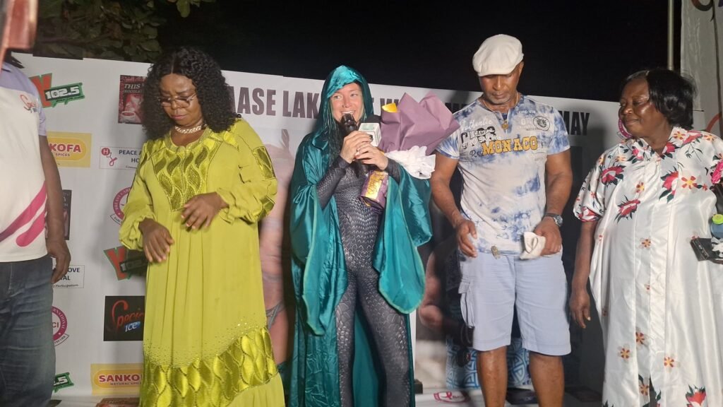 • The swimmer, May (third from right), addressing members of the communities that watched the event