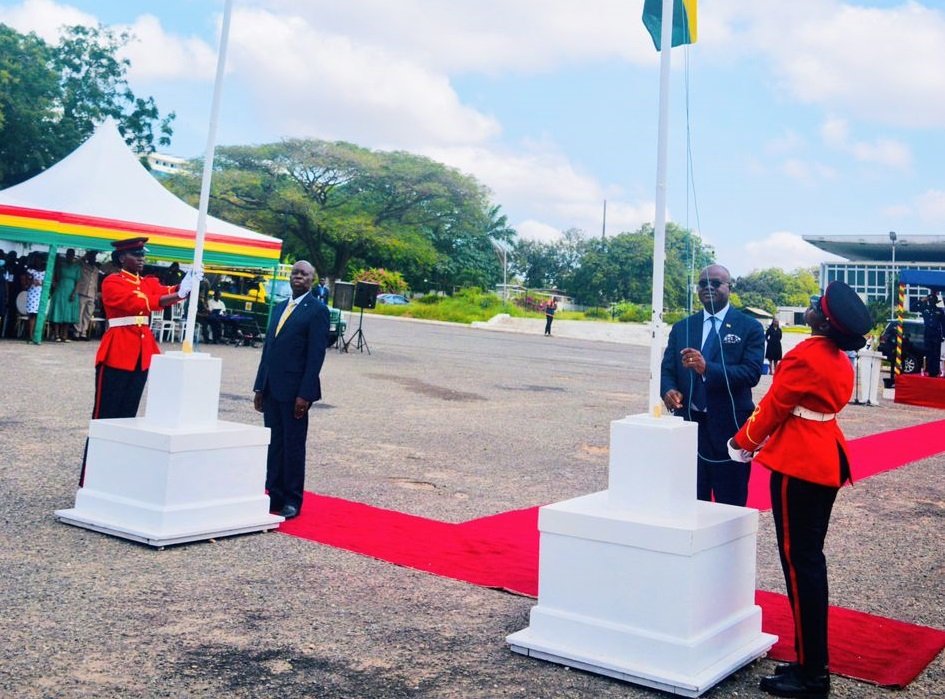 Mr Kwaku Ampratwum-Sarpong (second from right) hoisting the Ghana flag. Photo Stephanie Birikorang