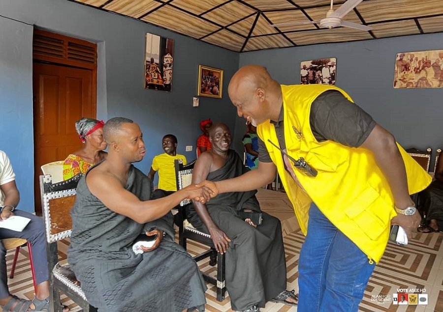 • Mr Hopeson Adorye (right) interacting with one of the chiefs