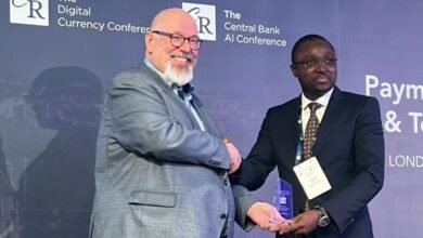 • The President and Chief Executive Officer of Currency Research, Jens Seidl (left), and the Director of FinTech Innovation, BoG, Mr Kwame A. Oppong, receiving the award