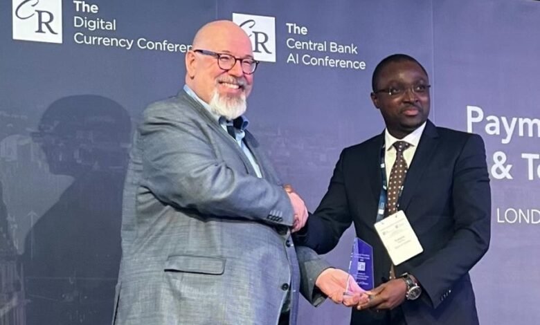 • The President and Chief Executive Officer of Currency Research, Jens Seidl (left), and the Director of FinTech Innovation, BoG, Mr Kwame A. Oppong, receiving the award