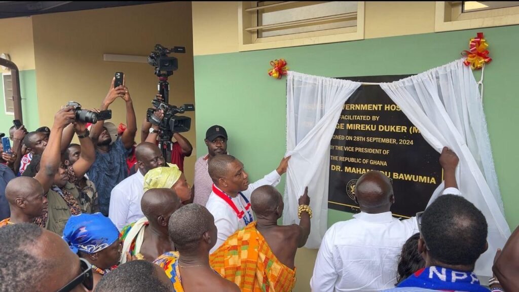 • Dr Bawumia (second from right) assisted by Mr&#xA;Duker (left) to unveil a plaque at the event.