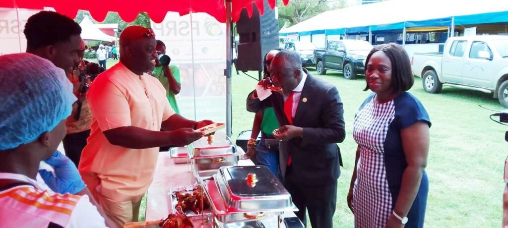 Mr Addo sampling one of the grilled chicken at the FSRP stand