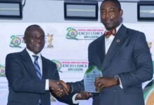 • Dr Okoe Boye (right) receiving a plaque at the NAS awards ceremony