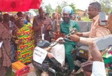 • Mr Appiah sitting on the tricycle and holding the sword,flanking him on his (left) is Mr Kusi and Mr Asiamah (right),and Chief of Adokwai