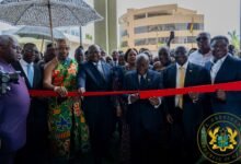 President Akufo-Addo (middle) being assisted by Dr Bawumia (second from right), Dr Ernest Addison (fourth from left), Ga Mantse, King Tackie Teiko Tsuru II (third from left), to cut the tape to open the facility