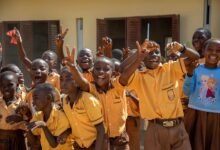 • The new Bosomtwe school block. Inset: Pupils happy about the block