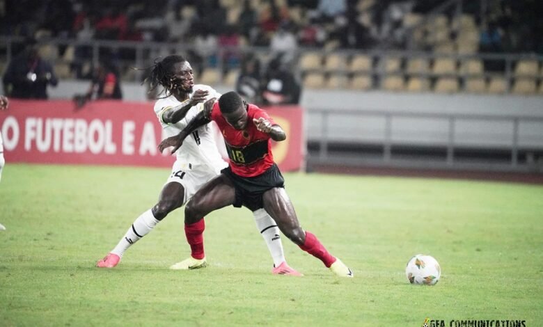 • Black Stars Gideon Mensah (in white) battles for supremacy with Angola’s Zito Luvumbo