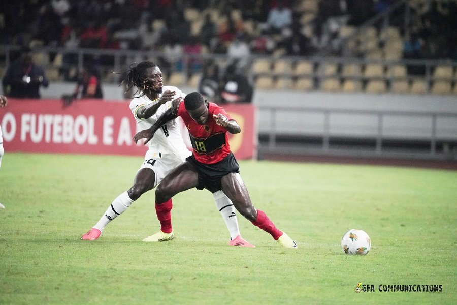 • Black Stars Gideon Mensah (in white) battles for supremacy with Angola’s Zito Luvumbo