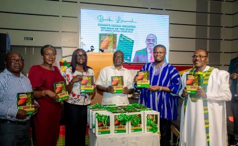 • Mr Yussif (second from right), Dr Ofosu-Asare (right), Dr Sarpong (third from right) and other dignitaries displaying copies of the book during the launch