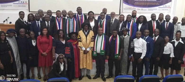 • The graduates and the inductees after the ceremony