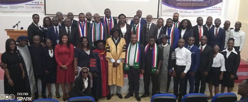 • The graduates and the inductees after the ceremony