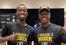 • Carl Lokko (right) and boxer John Laryea