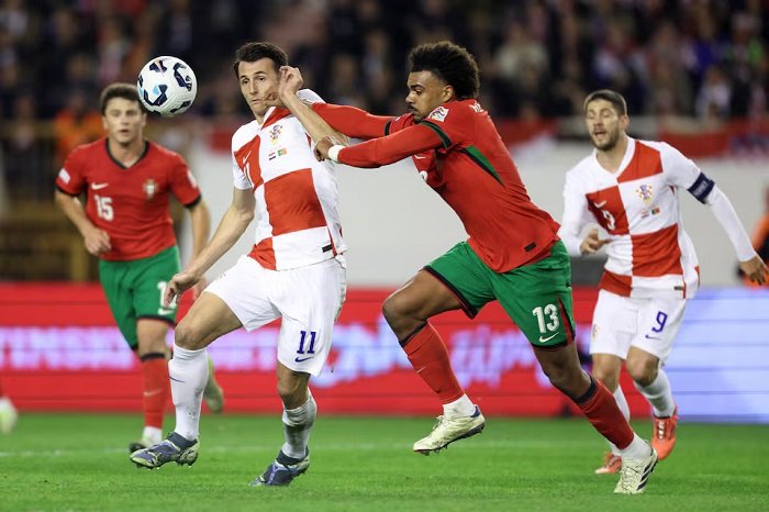 • Croatia's Ante Budimir in action with Portugal's Renato Veiga