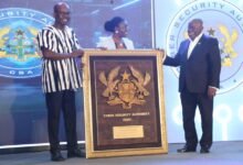 • President Akufo-Addo (right) receiving his award at the programme