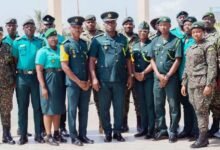 • Mr Doudu (middle) and Mr Normeshie (fourth from left) and other Immigration officers