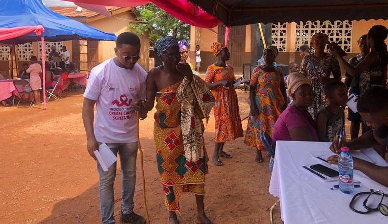 • A health worker assisting an aged woman to visit the consulting room, while others wait for their turn at the Subri programme