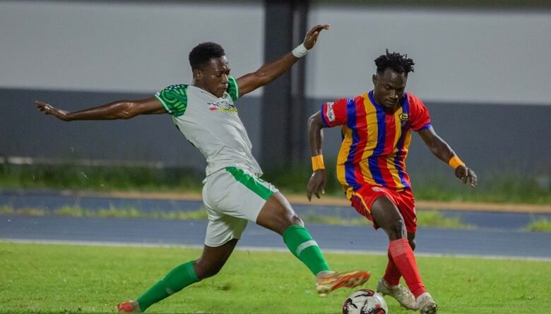 • Hearts of Oak’s Isshak Saani Mohammed (right) tries to outwit his Vision FC opponent Prince Asante Photo: Raymond Ackumey