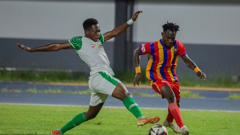 • Hearts of Oak’s Isshak Saani Mohammed (right) tries to outwit his Vision FC opponent Prince Asante Photo: Raymond Ackumey