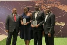 • Mr Kumar (left) with other officials of Interplast Limited displaying the awards